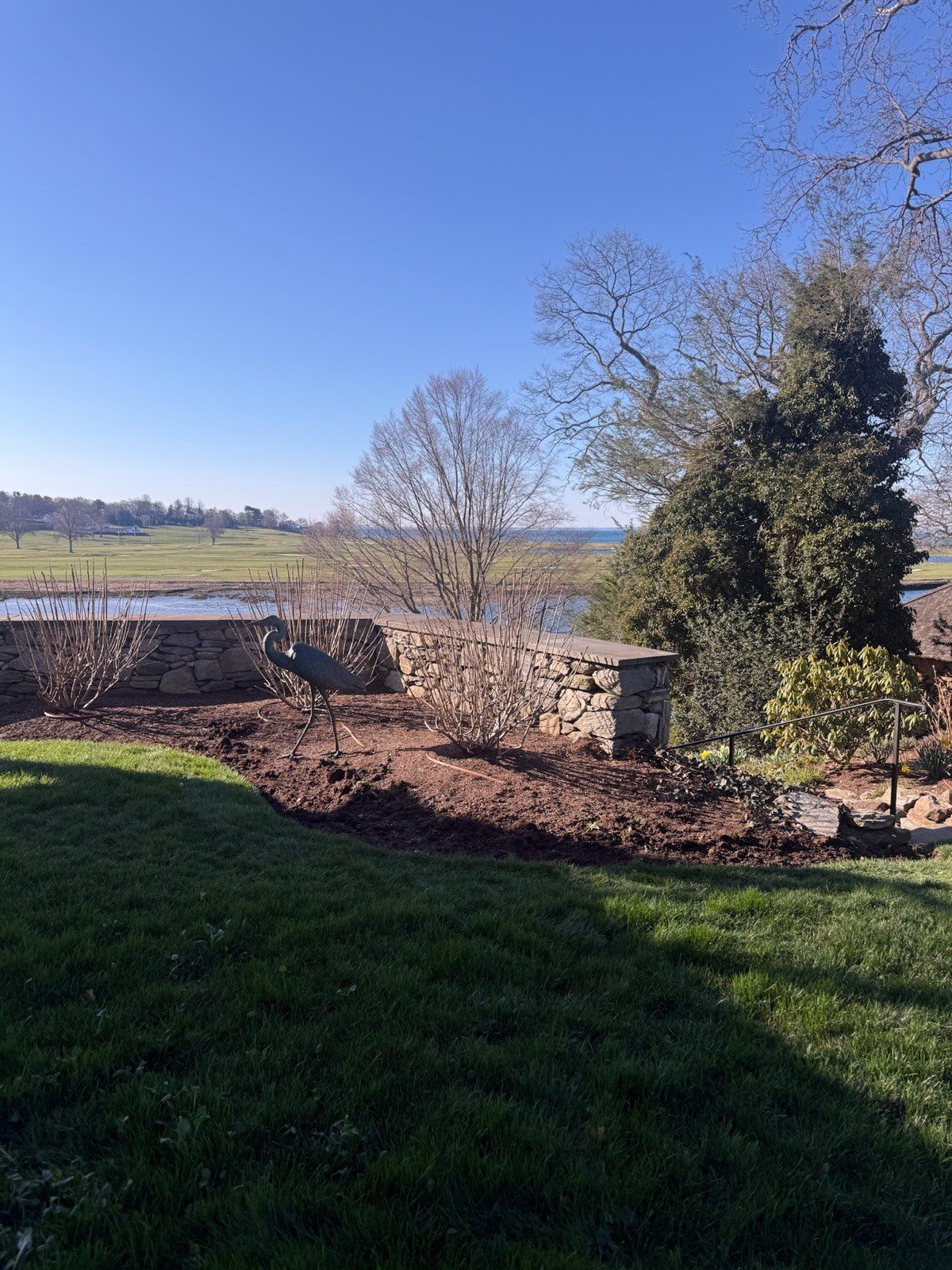 Natural stone retaining wall on a Long Island Sound waterfront property