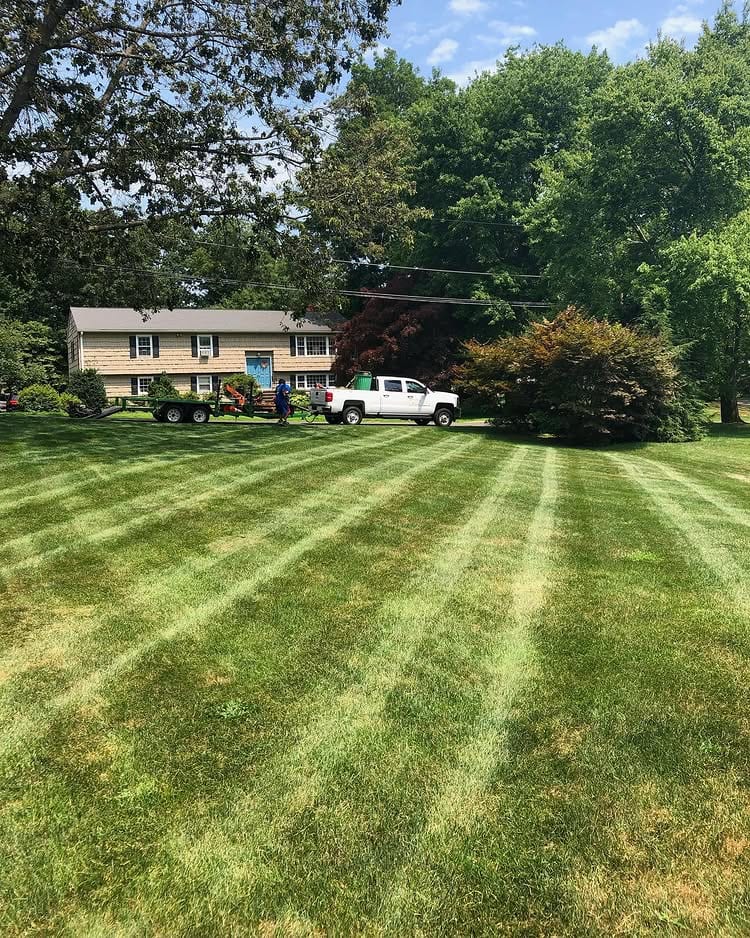 Striped residential lawn after mowing and maintenance in Fairfield County