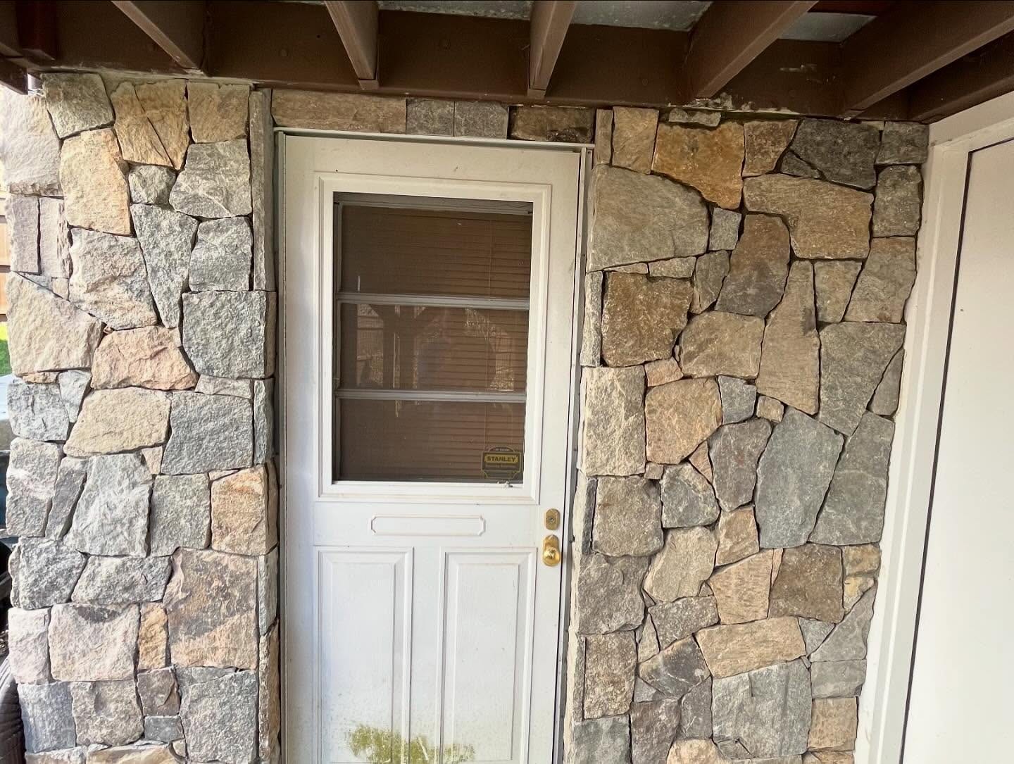 Natural stone veneer entry detail on a Fairfield County home