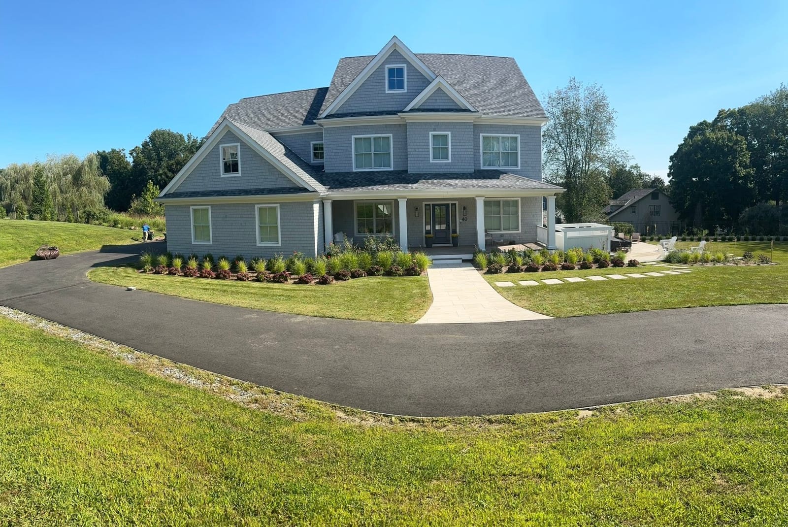 Complete property maintenance with trimmed lawn and foundation plantings